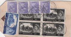 137712 1969 BANKERS 'HIGH VALUE PACKET' REGISTERED PARCEL LABEL WITH CASTLE ISSUE 10S AND £1 BLOCK OF FOUR.