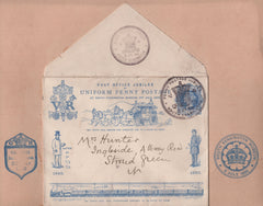 137906 1890 PENNY POSTAGE JUBILEE, 1D BLUE ENVELOPE WITH SOUTH KENSINGTON HAND STAMPS ON CARD WITH OTHER EXHBITION HAND STAMPS.