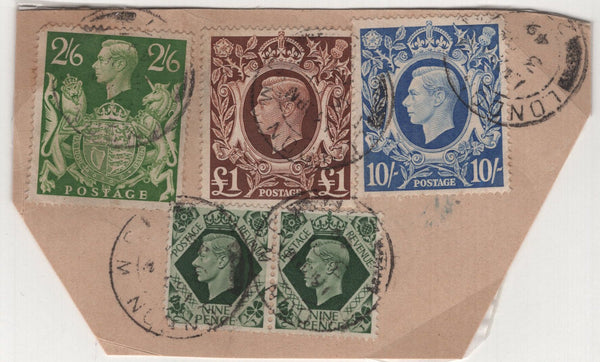 140044 1949 CUT OUT PIECES EX PARCELS WITH KGVI HIGH VALUES INCLUDING £1 BROWN (SG478c).