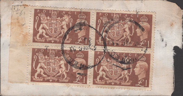 141251  1953 CLOTH BANKERS TAG SENT AIR MAIL LONDON TO AUCKLAND, NEW ZEALAND WITH BLOCK OF FOUR KGVI £1 BROWN (SG512).