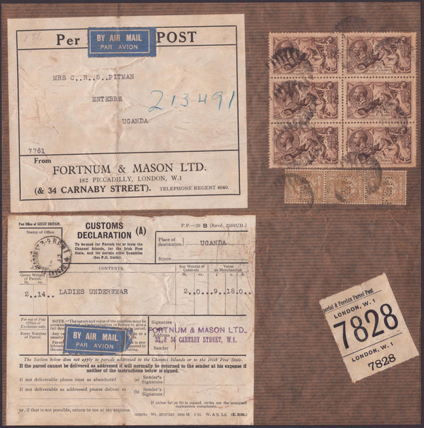 142027 1933 PART PARCEL WRAPPING AIR MAIL LONDON TO UGANDA WITH SEAHORSE 2/6 (SG415a) X 6 AND 1S (SG429) X 3.