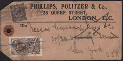 142050 CIRCA 1915 PARCEL TAG LONDON TO NEW YORK, USA 2/6 DE LA RUE SEAHORSE (SG406) AND 9D AGATE (SG392).