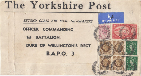 144035 1953 PARCEL LABEL AIRMAIL LEEDS TO 'B.A.P.O. 3' KGVI 6d, 1s BLOCK OF FOUR, 5s RED (SG510) AND QEII 1½d WILDING x 2.
