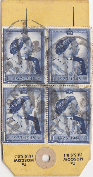 144123 CIRCA 1950 PARCEL TAG, NO ADDRESS ALTHOUGH 'TO MOSCOW (U.S.S.R.) IMPRINT KGVI HIGH VALUES INCL. £1 ROYAL SILVER WEDDING (SG494) BLOCK OF FOUR.