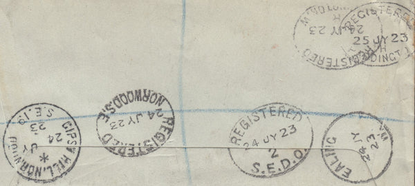 114939 1923 POSTAL STATIONERY CUTOUTS ON REGISTERED MAIL USED IN LONDON.